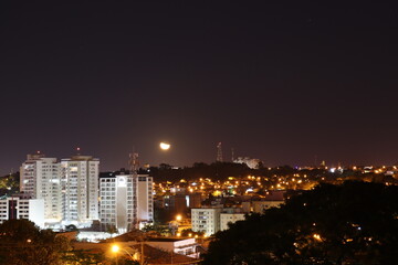 night view of the city with moon