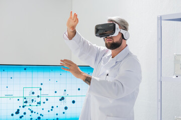 Genetic engineers are using Virtual Reality technology. Professional team of scientists is working...