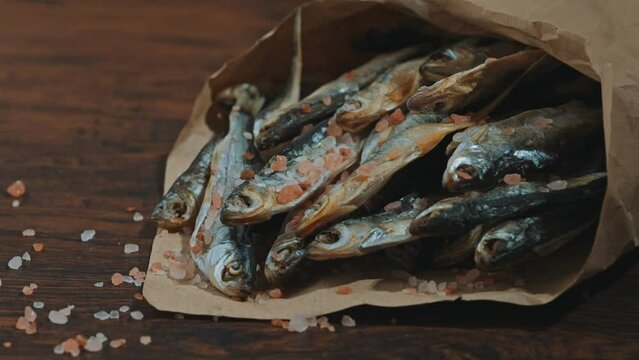 Lots of sun dried fish in the paper bag.