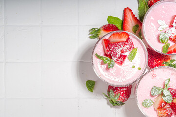 Homemade sweet strawberry panna cotta dessert, pink Italian panna cotta in three glasses, with...