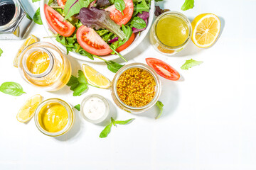 Variety of homemade salad dressings. Set of various salad sauces, oil, vinaigrette, mustard, mayonnaise, ranch, balsamic, soy, yogurt dressings