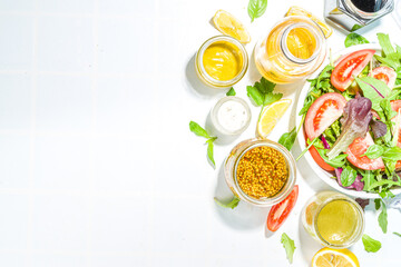Variety of homemade salad dressings. Set of various salad sauces, oil, vinaigrette, mustard,...