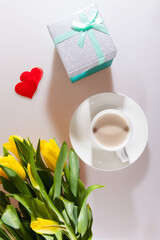 Yellow tulips, a surprise box and a cup of espresso. Romantic evening