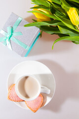 Yellow tulips, a surprise box and a cup of espresso. Romantic evening