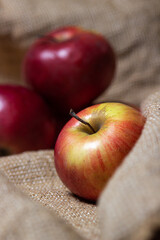 Apples with low depth of field. Red apples on burlap