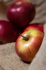 Apples with low depth of field. Red apples on burlap