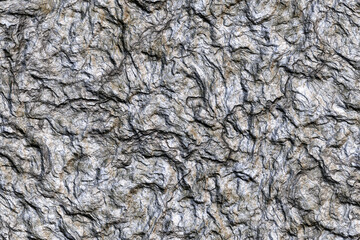 Detailed rock texture and surface background. Weathered, grunge natural stone