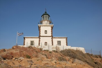 Fototapeta na wymiar The beautiful lighthouse Akrotiri on the island of Santorini Greece