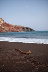 Panoramic view of the famous red beach on a windy day in Santorini 