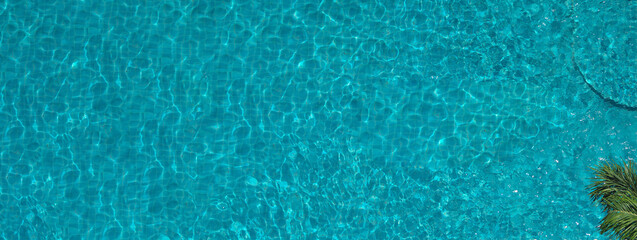 Swimming pool blue water in summer top view angle. Aerial view images of swimming pool in a sunny day which suitable for sport or relax on vacation time or workout for burn some calories in holiday.
