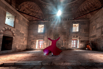 02.04.2022,Soke,Aydin,Turkey,whirling dervish performing in red costume and hat