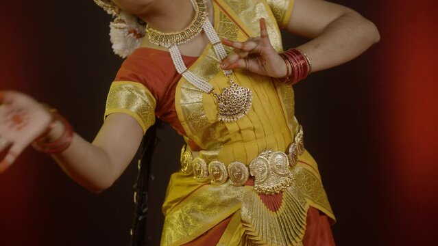 Close up shot, bharatanatyam dancer showing mudra or hand gestures on stage - cocnept of Indian culture, classical dancer and tradition.
