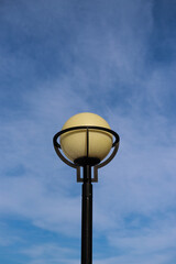 spherical lamppost on a blue sky background