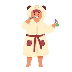 Cute child in a bathrobe brushes her teeth with a toothbrush.