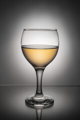 glass of wine on gray background