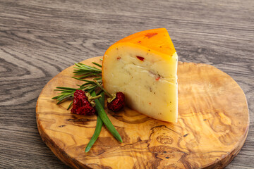 Hard cheese with dry tomato