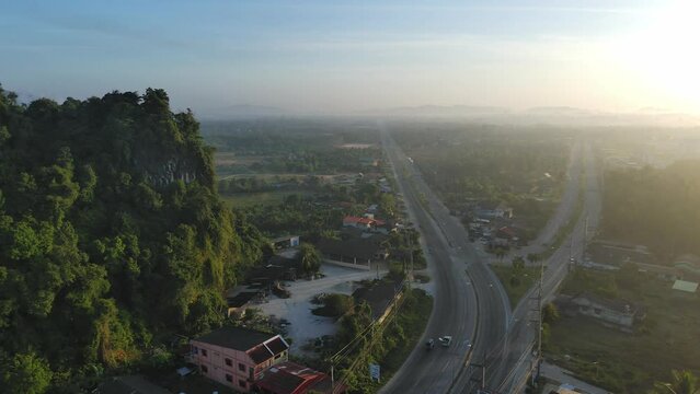 aerial view of road and home,beautiful nature in the morning,shot from top view,fly straight up to the top