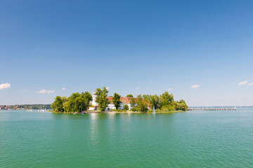 Island Fraueninsel on Lake Chiemsee on a sunny summer day with ferry
