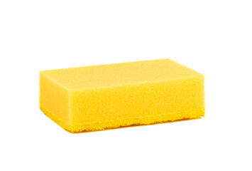 Close-up of a yellow sponge for washing dishes on a white background.