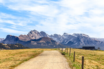Scenic road on Seiser Alm plateau with a beautiful view of Langkofel Group mountains range