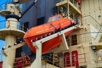 Standing by of the lifeboat install on aft of the ship for emergeny case incedent at the sea, save lifes and crews members saving at middle of the sea accident