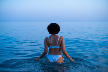 Fototapeta na wymiar woman swimming in bikini