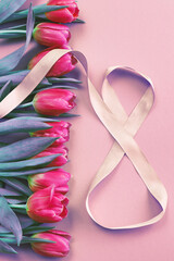 8 March card design with pink tulips and ribbon in the shape of number eight. International Women s Day