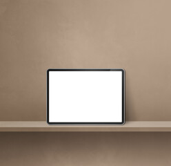 Digital tablet pc on brown wall shelf. Square background banner