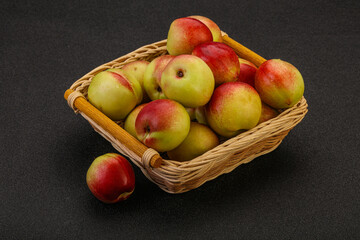 Sweet small nectarines in the basket