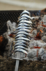 Grilled sardine skewers (espetos) on the beach in Malaga, Costa del Sol, Andalusia, Spain