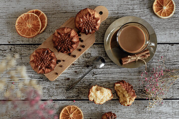 Flat lay delicious breakfast latte coffee and homemade muffins on wooden background
