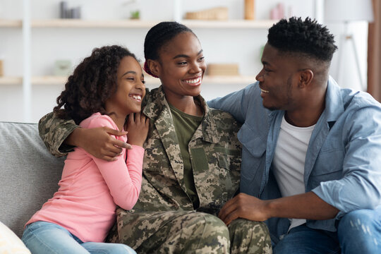 Loving Black Woman In Camouflage Uniform Having Conversation With Family