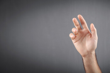 Caucasian man showing empty hand.