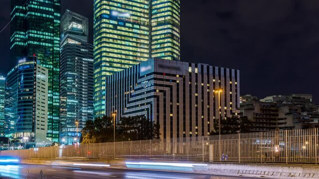 Pedestrian View of La Defense Business District at Night With Road Traffic Paris Buildings