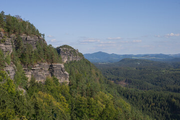 view from the top of the mountain to the forest in the valley of the national park of Czech switzerland