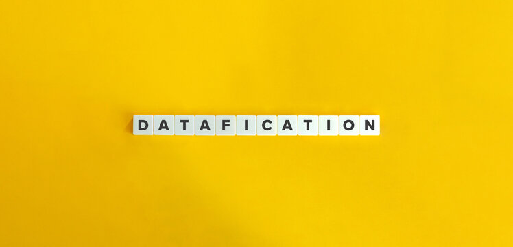 Datafication Word on Letter Tiles on Yellow Background. Minimal Aesthetics.