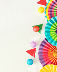 Holidays Mexico background. Paper fans, garlands in the colors of Mexico on a white background with...