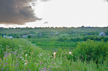 Village on the hilly bank of the river 