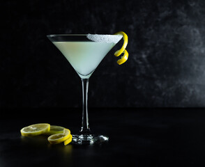 Lemon Drop Martini on dark background with lemon twist