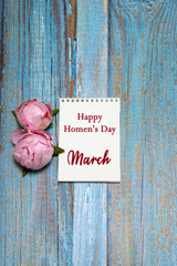 pink peonies, a leaf with the text: "March. Happy women's day" on a blue wooden background. card, congratulations on March 8