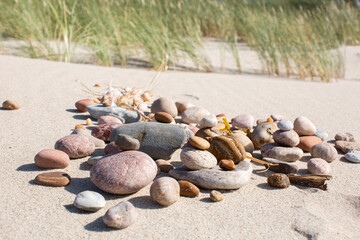 Sand and different stone pebbles as background. 