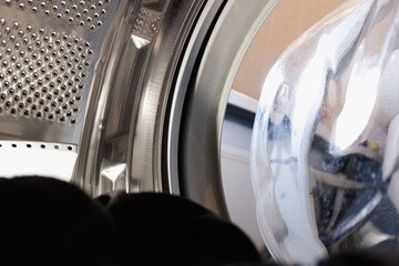 view from washing machine with black clothes