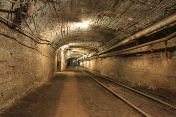 Narrow gauge railroad in the underground mine horizon. Technologies of mining of minerals by the...