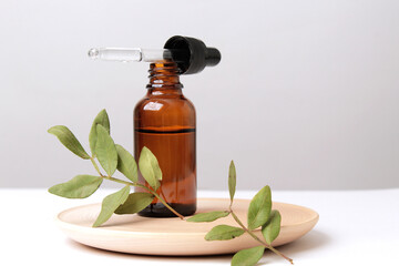 Brown glass bottle with serum, essential oil or other cosmetic product. Natural organic cosmetic...