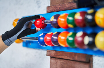 Anonymous person moving ball on pool scoreboard