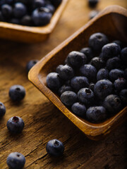Large juicy blueberries in a bowl. Close-up. Vitamins, antioxidants. Cooking, medicine, supermarket, forestry and farming. A bountiful harvest. There are no people in the photo.