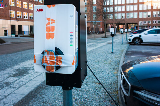 Vasteras, Sweden - February 10, 2022: ABB charging station in parking lot, sealed with ABB tape not in service