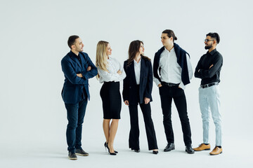 Obraz premium Happy business team smiling isolated over a white background