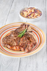 Pan-fried T-bone steak with fresh rosemary