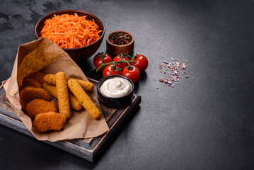 Breaded mozzarella cheese sticks served with tomato sauce